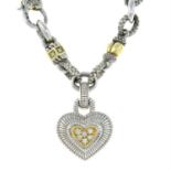 A diamond accent heart pendant, suspended from a fancy-link bi-colour chain, by Judith Ripka.