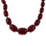 A bakelite single-strand necklace, with bead spacers.