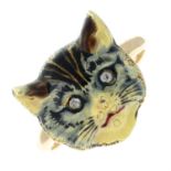 An early 20th century gold and enamel cat ring, with single-cut diamond eyes.