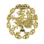 A brooch, possibly depicting the Royal crest of Skåne, Sweden.