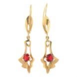 A pair of red paste accent drop earrings.