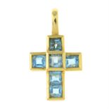 An 18ct gold blue topaz cross pendant, by Theo Fennell.