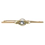 An early 20th century aquamarine and split pearl bar brooch.