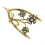 An early 20th century 15ct gold split pearl floral wishing bone brooch.