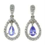 A pair of tanzanite and diamond drop earrings.