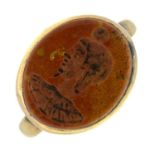 A hardstone intaglio ring, depicting an Egyptian figure with a disc above their head.