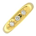 An 18ct gold brilliant-cut diamond three-stone ring.