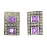 A pair of pink sapphire and brilliant-cut diamond stud earrings.