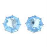 A pair of blue topaz earrings.