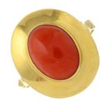 A coral cabochon cocktail ring.