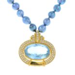 A blue topaz and diamond pendant, suspended from an integral dyed freshwater cultured pearl