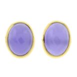 A pair of violet jade stud earrings.