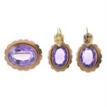 A set of amethyst jewellery, comprising a pair of earrings and a brooch.