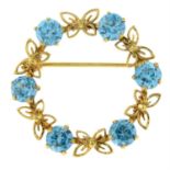 A mid 20th century 9ct gold blue zircon wreath brooch, by Cropp & Farr.