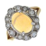 An 18ct gold opal cabochon and brilliant-cut diamond cluster ring.