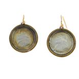 A pair of late 19th century locket earrings, containing 1868 soldi coins.