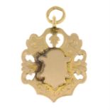 A mid 20th century 15ct gold shield medallion pendant.