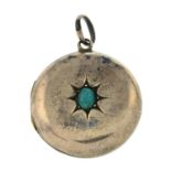 An early 20th century gold front and back turquoise locket pendant.