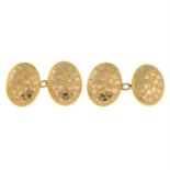 A pair of late Victorian 9ct gold foliate engraved cufflinks.
