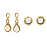 Two pairs of gold cultured pearl earrings.