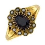 An Edwardian 18ct gold garnet and split pearl cluster ring.