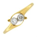 An 18ct gold old-cut diamond two-stone crossover ring.