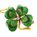 An early 20th century gold enamel and old-cut diamond four leaf clover brooch.