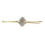 An early 20th century 15ct gold opal single-stone bar brooch.