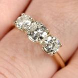 A graduated brilliant-cut diamond three-stone ring.