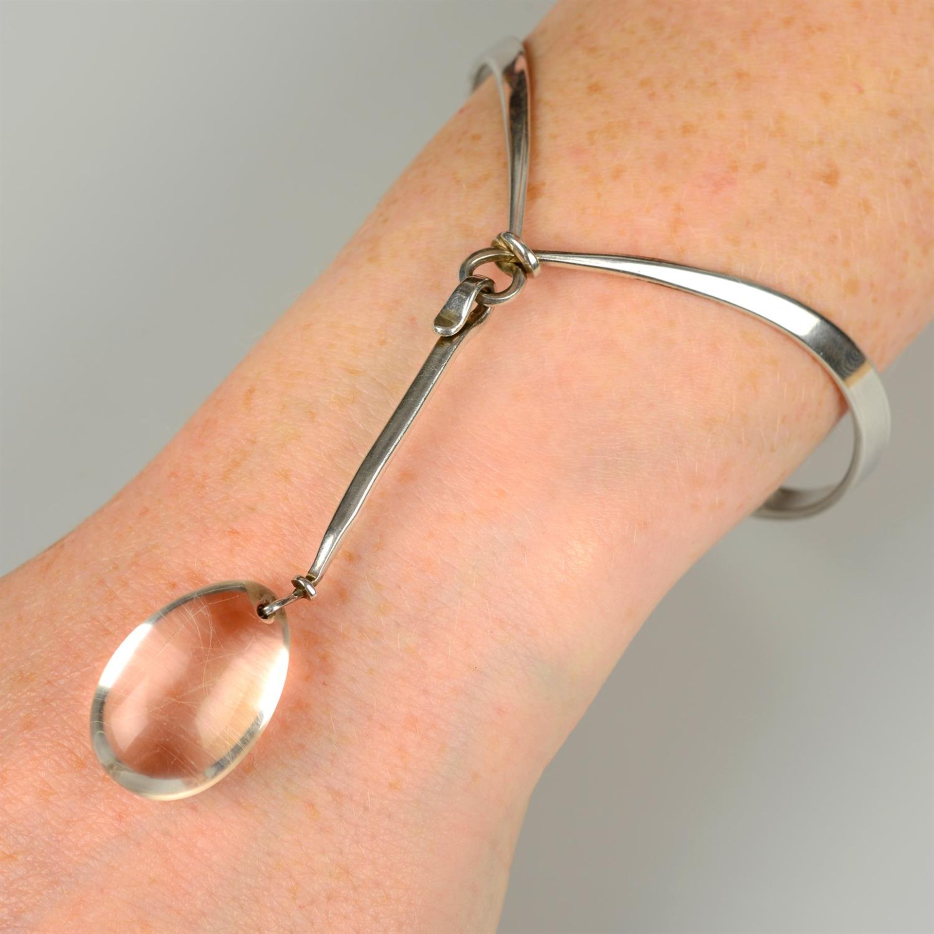 A rutilated quartz 'Dew Drop' bangle by Torun Bülow-Hübe for Georg Jensen.