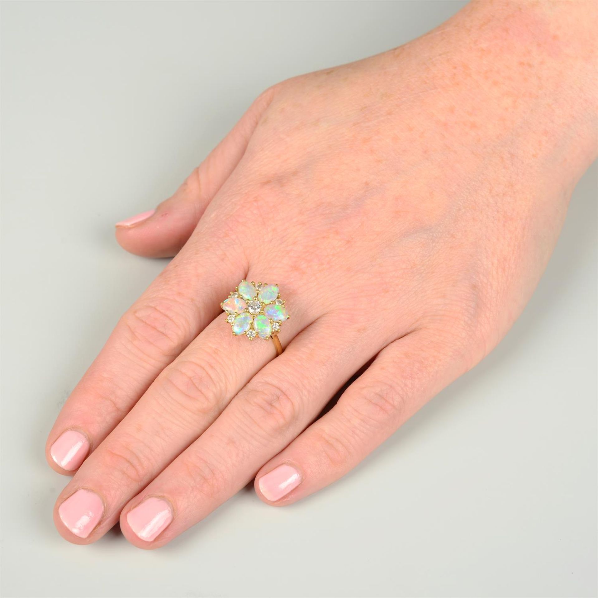 An 18ct gold opal and brilliant-cut diamond floral cluster ring, by Cropp & Farr. - Image 5 of 5