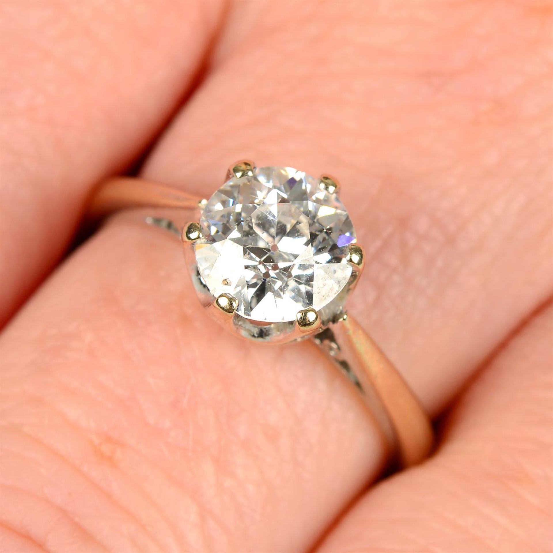 An 18ct gold circular-cut diamond single-stone ring.