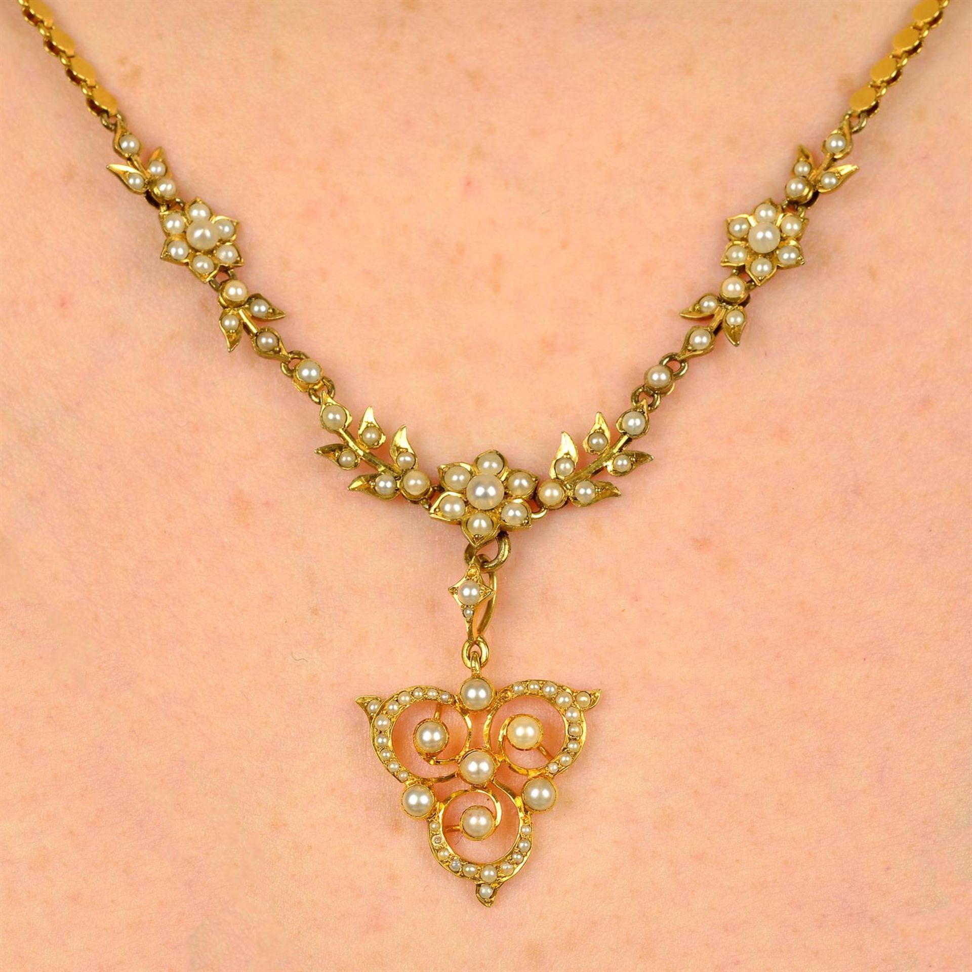 A composite early 20th century gold split pearl necklace, with detachable pendant.