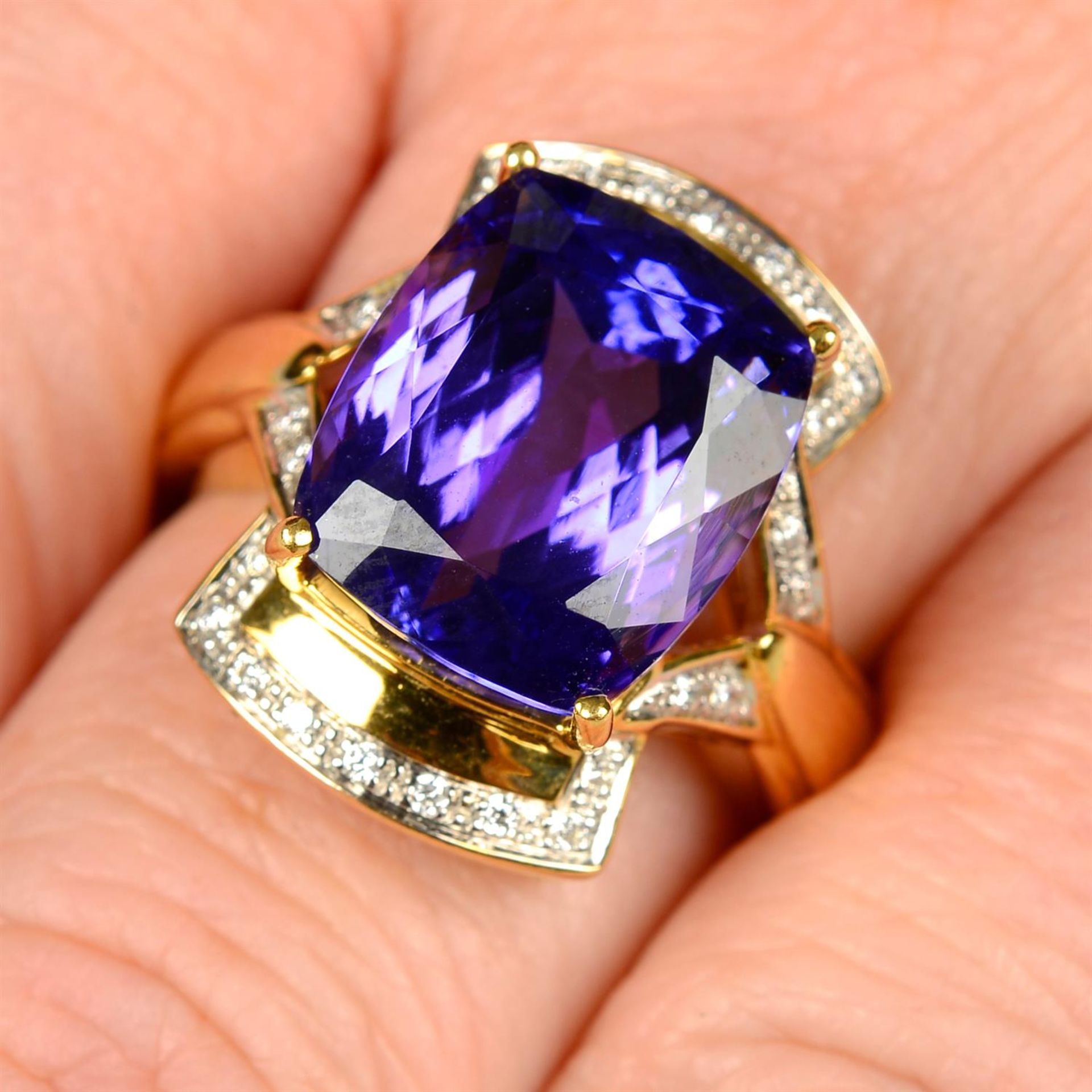 An 18ct gold tanzanite and brilliant-cut diamond dress ring.