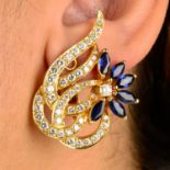 A pair of sapphire and brilliant-cut diamond floral earrings.