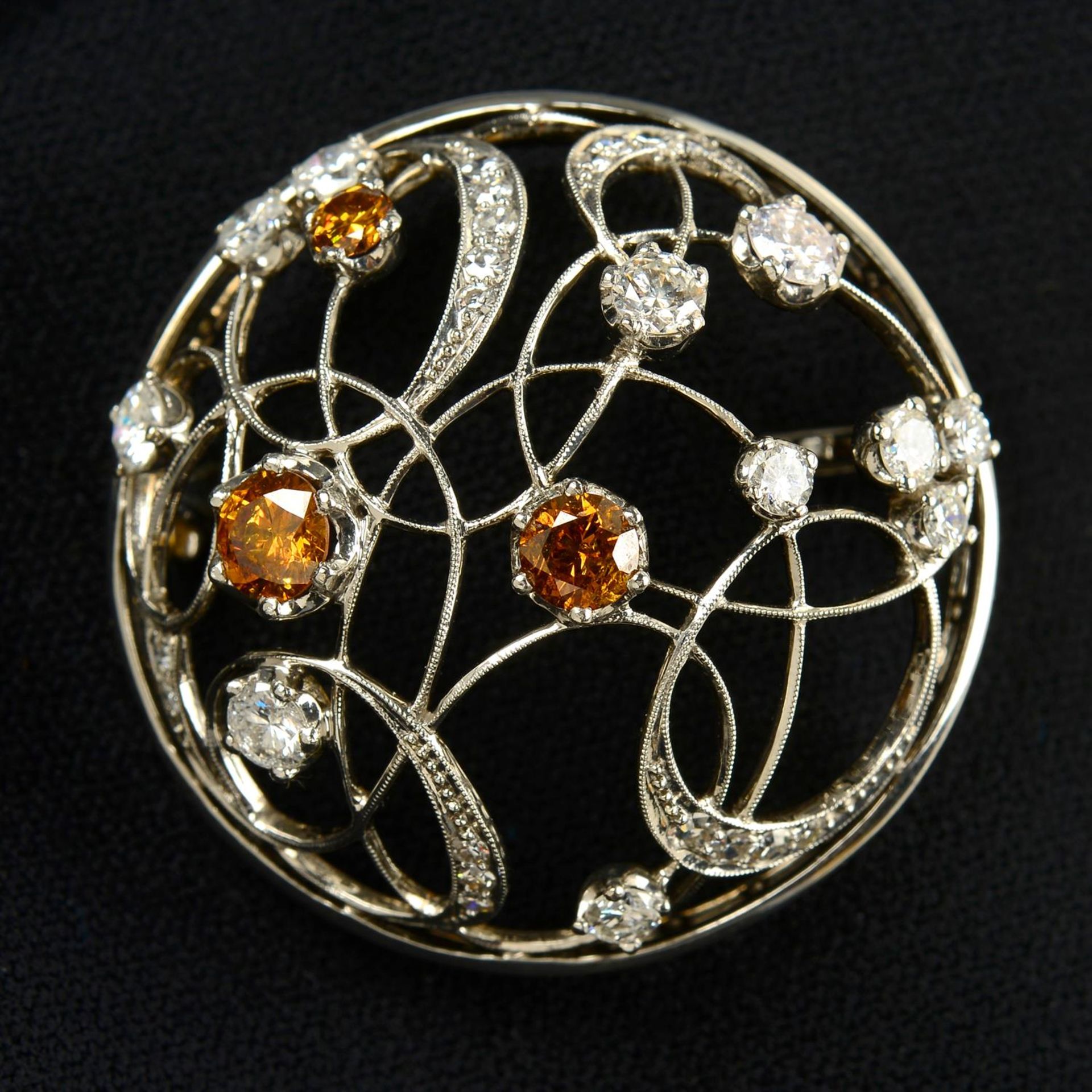 A 'brown' diamond, brilliant and single-cut diamond domed openwork brooch.