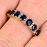 An 18ct gold sapphire and diamond spacer half eternity ring.