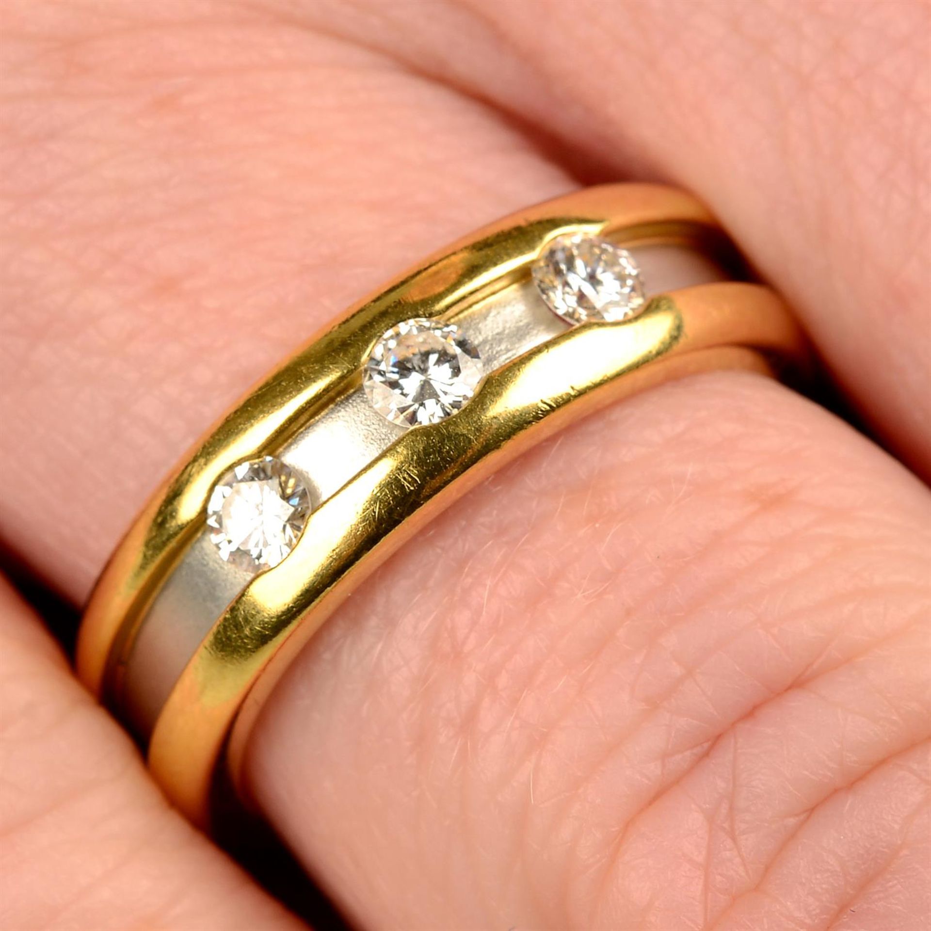 A bi-colour 18ct gold brilliant-cut diamond band ring, by Boodles.