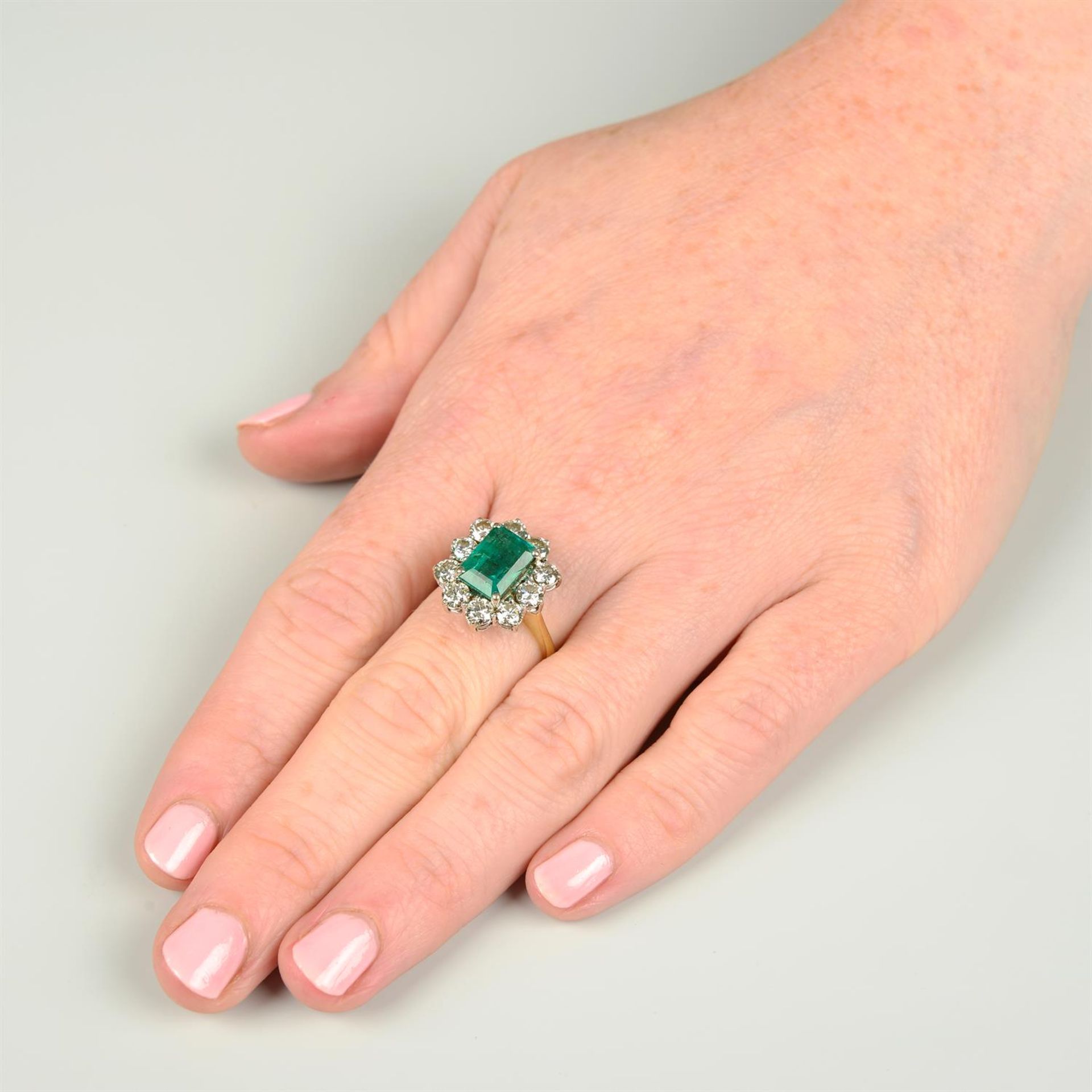 An 18ct gold emerald and brilliant-cut diamond cluster ring. - Image 5 of 5