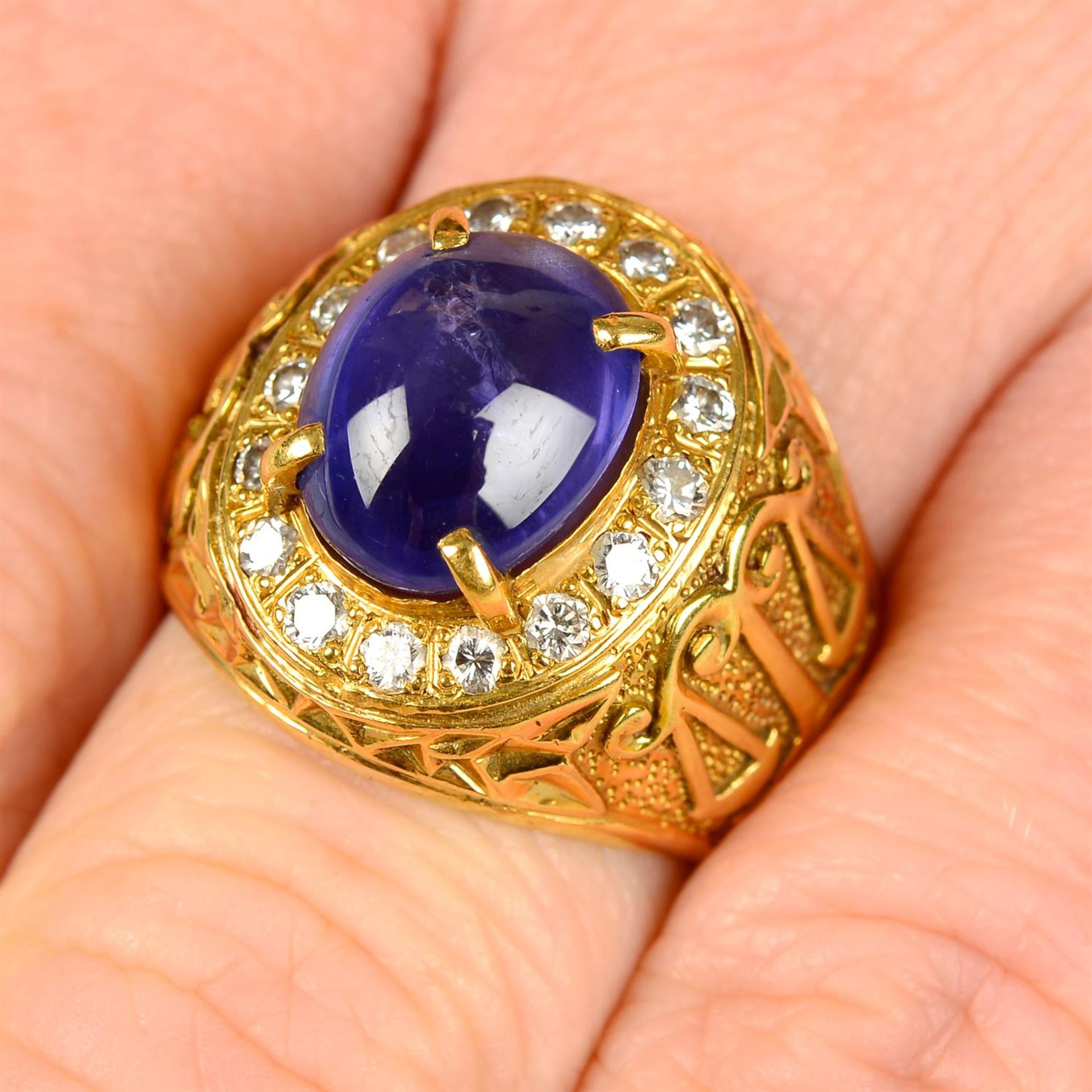 A star sapphire cabochon and brilliant-cut diamond cluster Libra zodiac ring, with scales to the