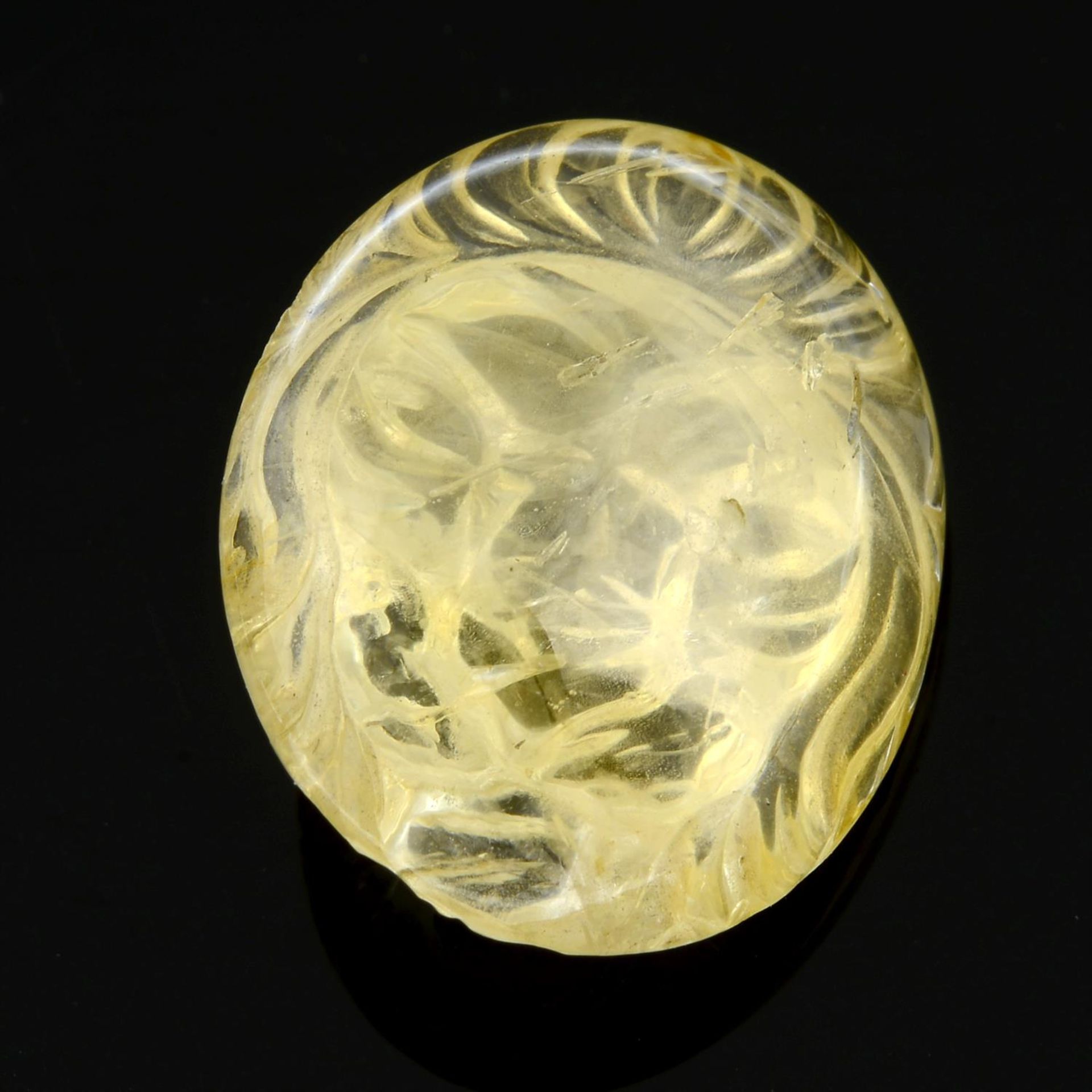 A carved Sri Lankan yellow sapphire, depicting a lion's head. - Image 3 of 3