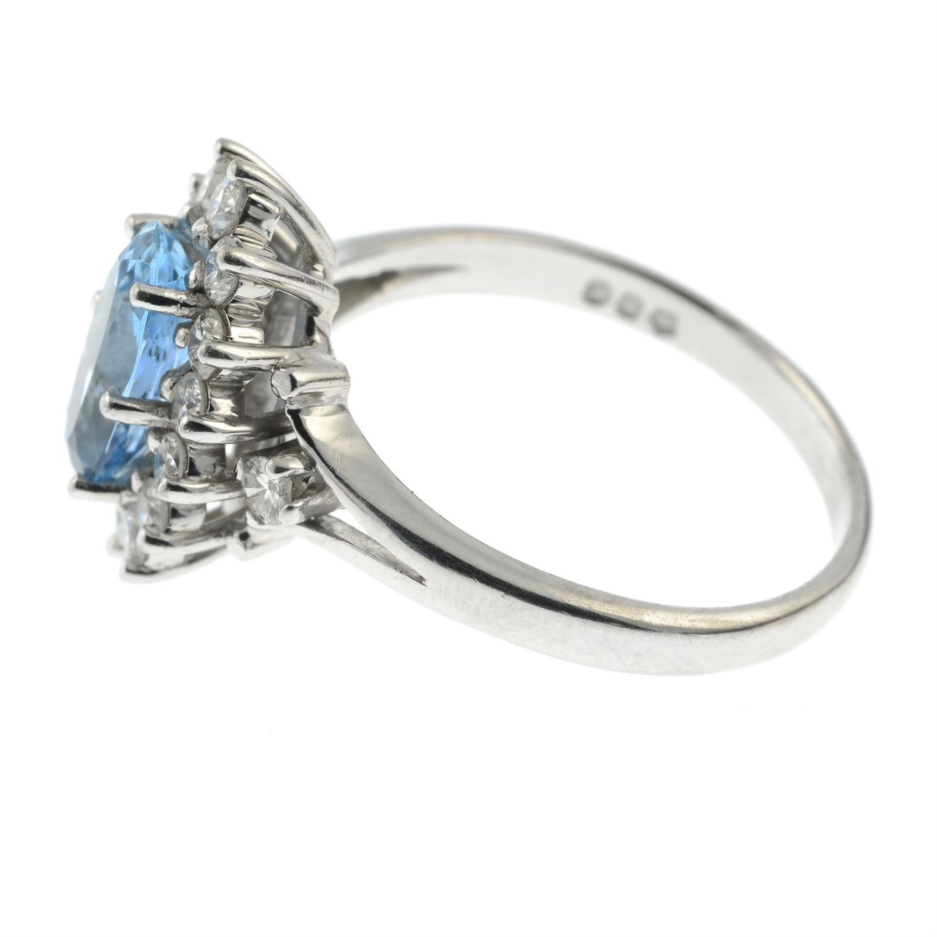 A platinum, aquamarine and brilliant-cut diamond cluster ring. - Image 3 of 5