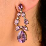 A pair of amethyst drop earrings, each with brilliant-cut diamond spacers.