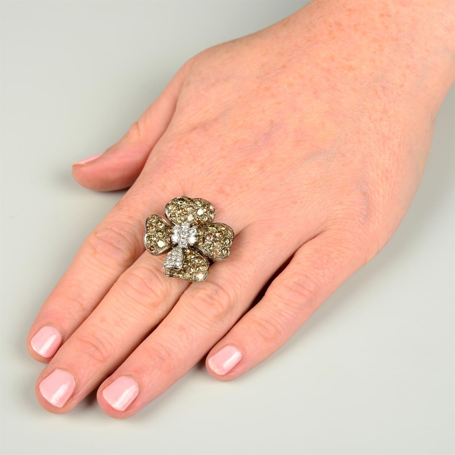 A brilliant-cut diamond and 'brown' diamond floral dress ring. - Image 5 of 5