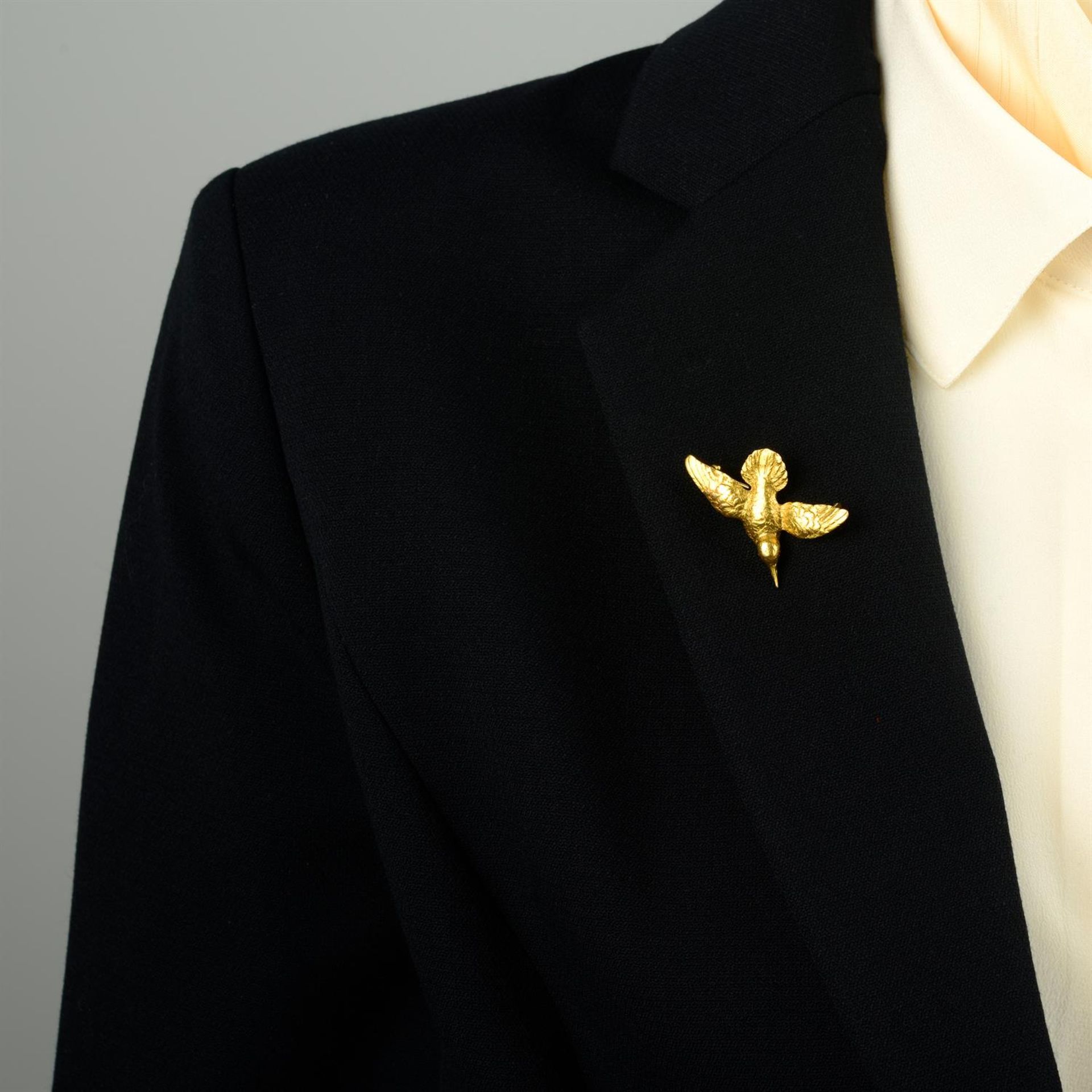 An early 20th century gold bird brooch, possibly a hummingbird, with ruby eyes. - Image 4 of 4