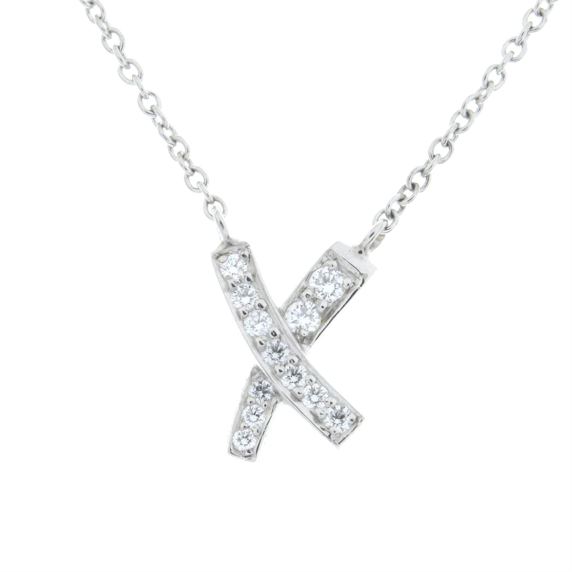 A diamond 'Kiss' cross pendant, on chain, by Paloma Picasso for Tiffany & Co. - Image 2 of 4