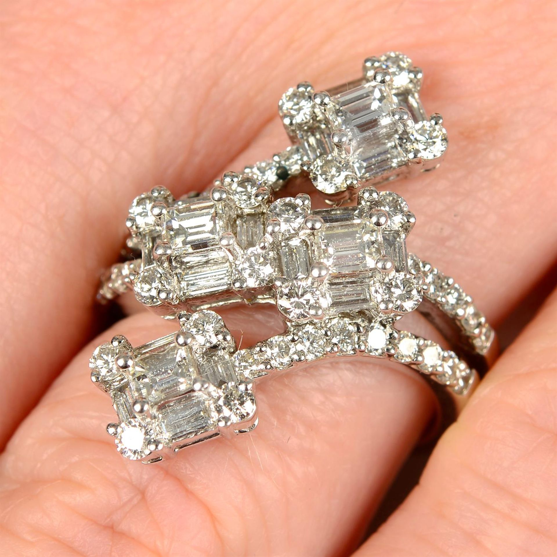 A platinum vari-shape diamond dress ring.