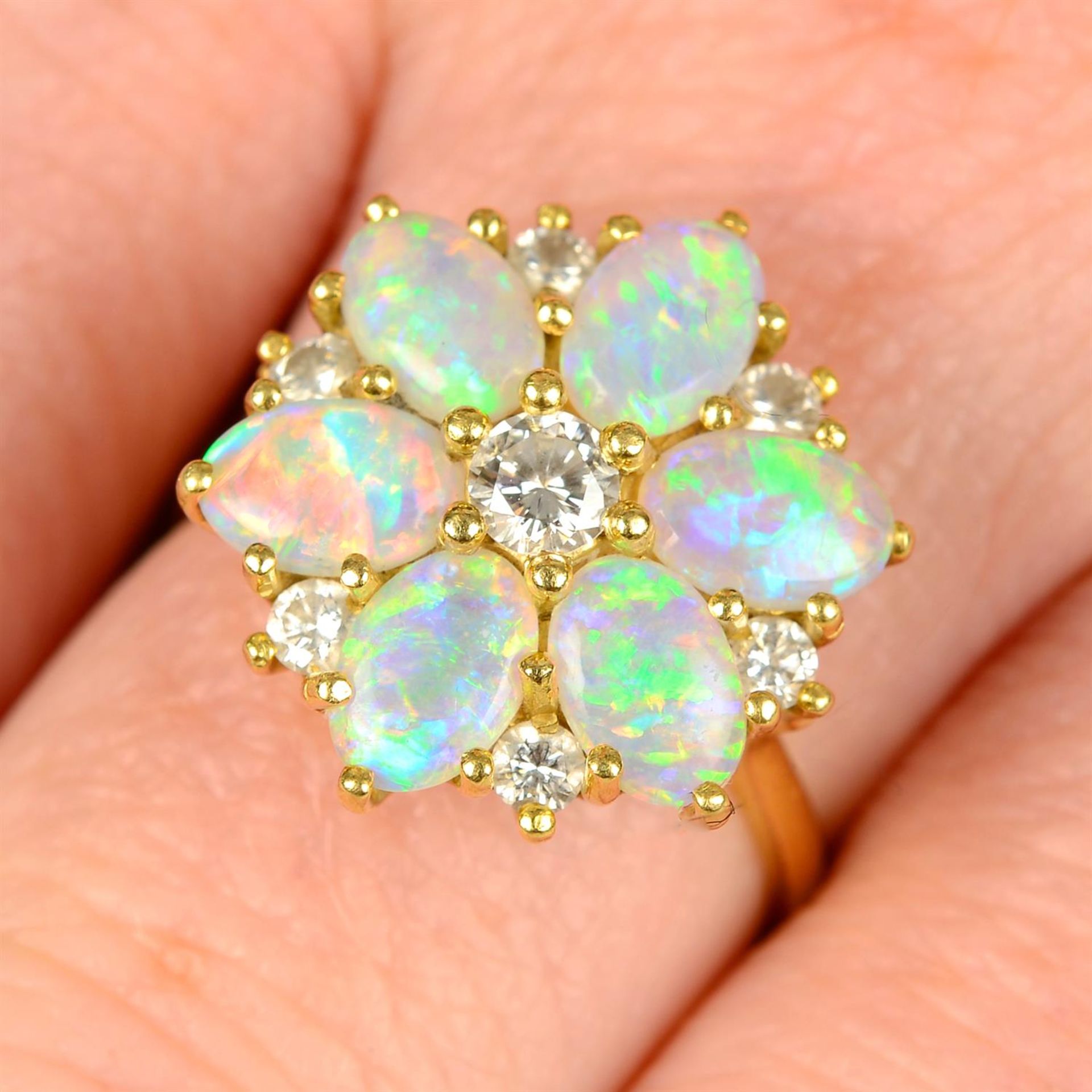 An 18ct gold opal and brilliant-cut diamond floral cluster ring, by Cropp & Farr.