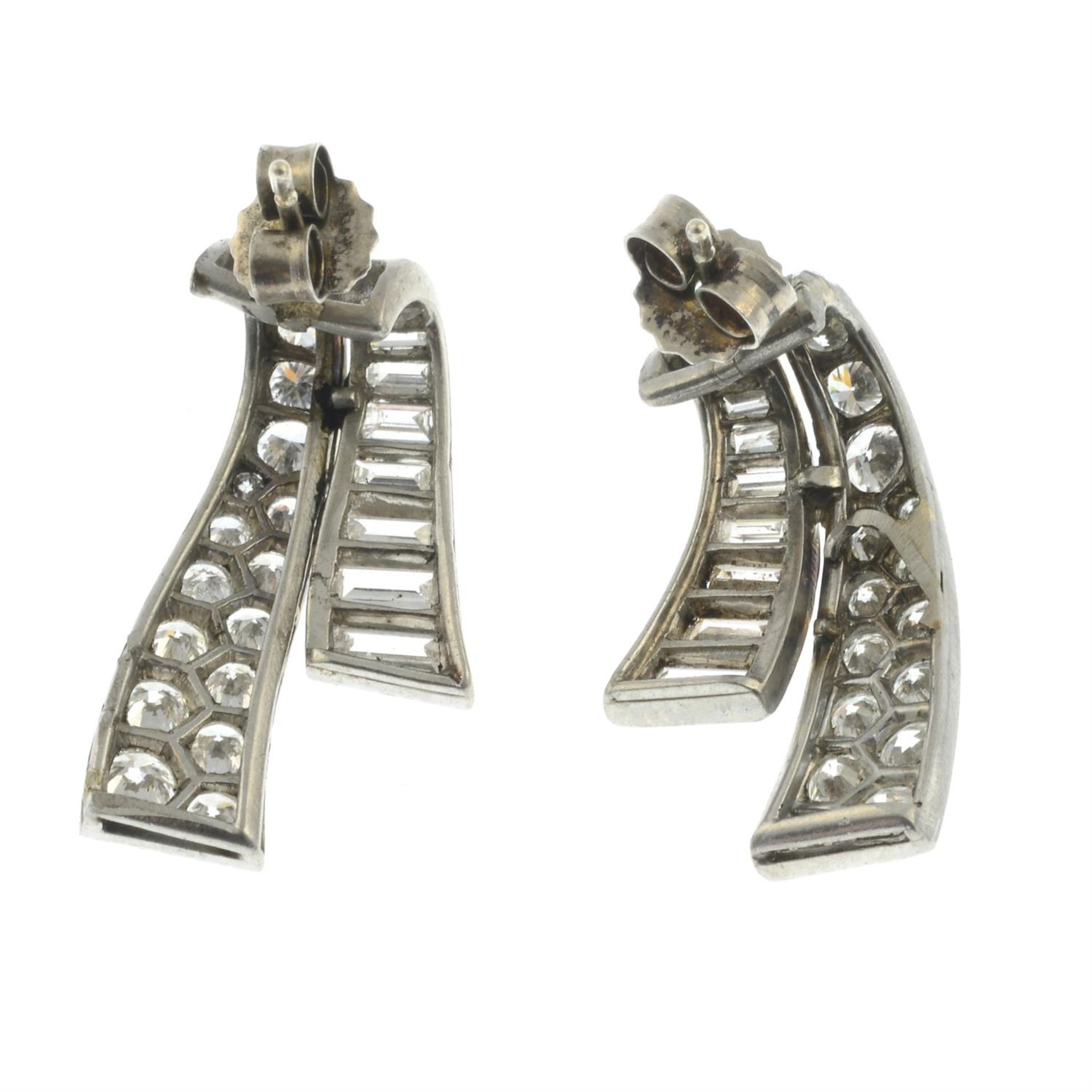A pair of mid 20th century platinum baguette and brilliant-cut diamond scroll earrings. - Image 3 of 3