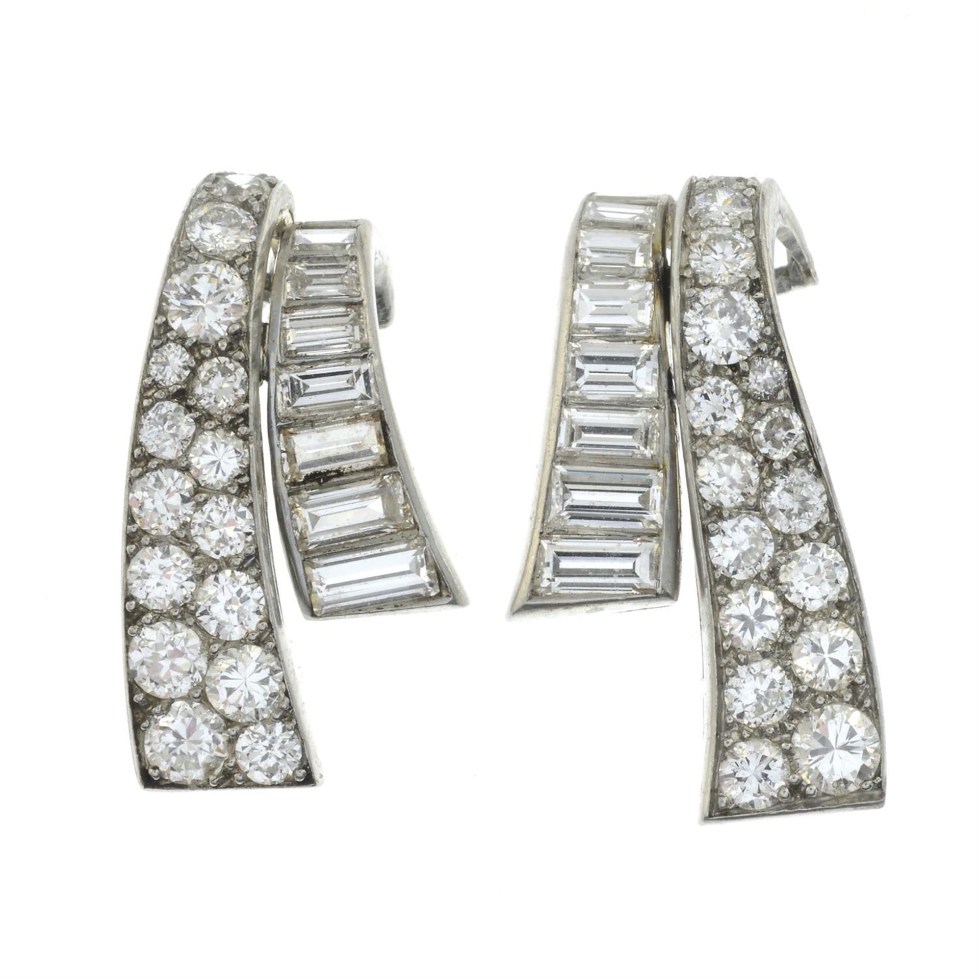 A pair of mid 20th century platinum baguette and brilliant-cut diamond scroll earrings. - Image 2 of 3